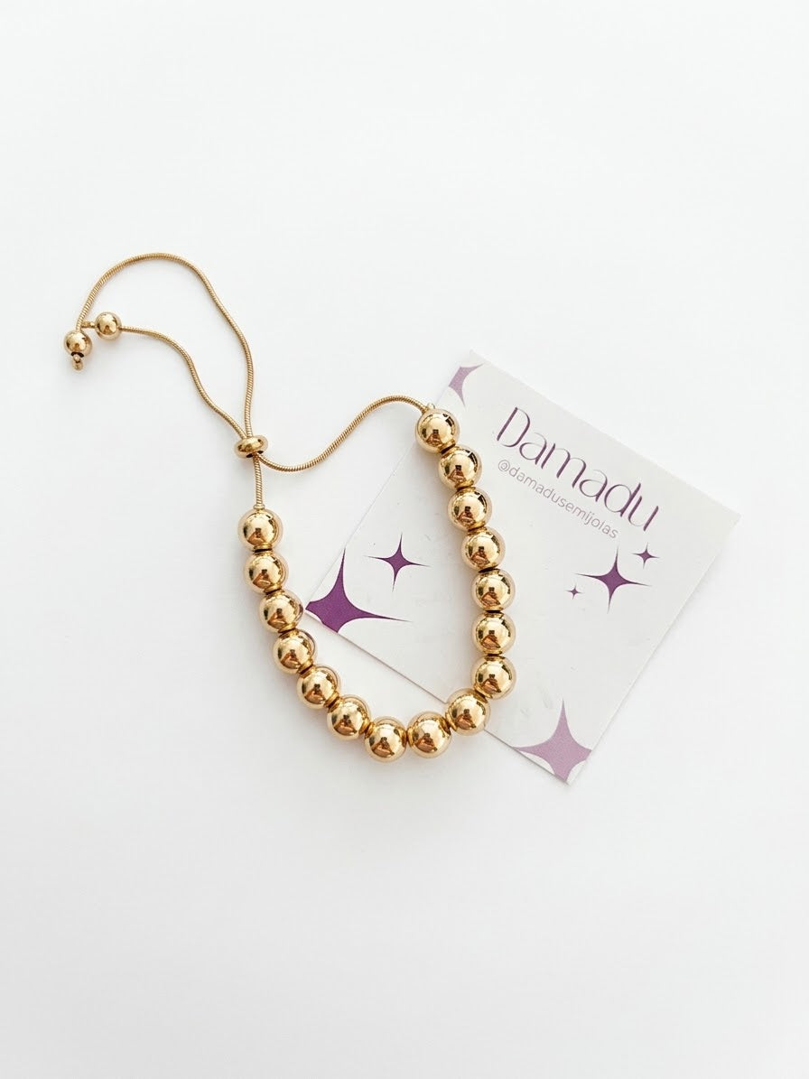 Pulseira bolinhas douradas